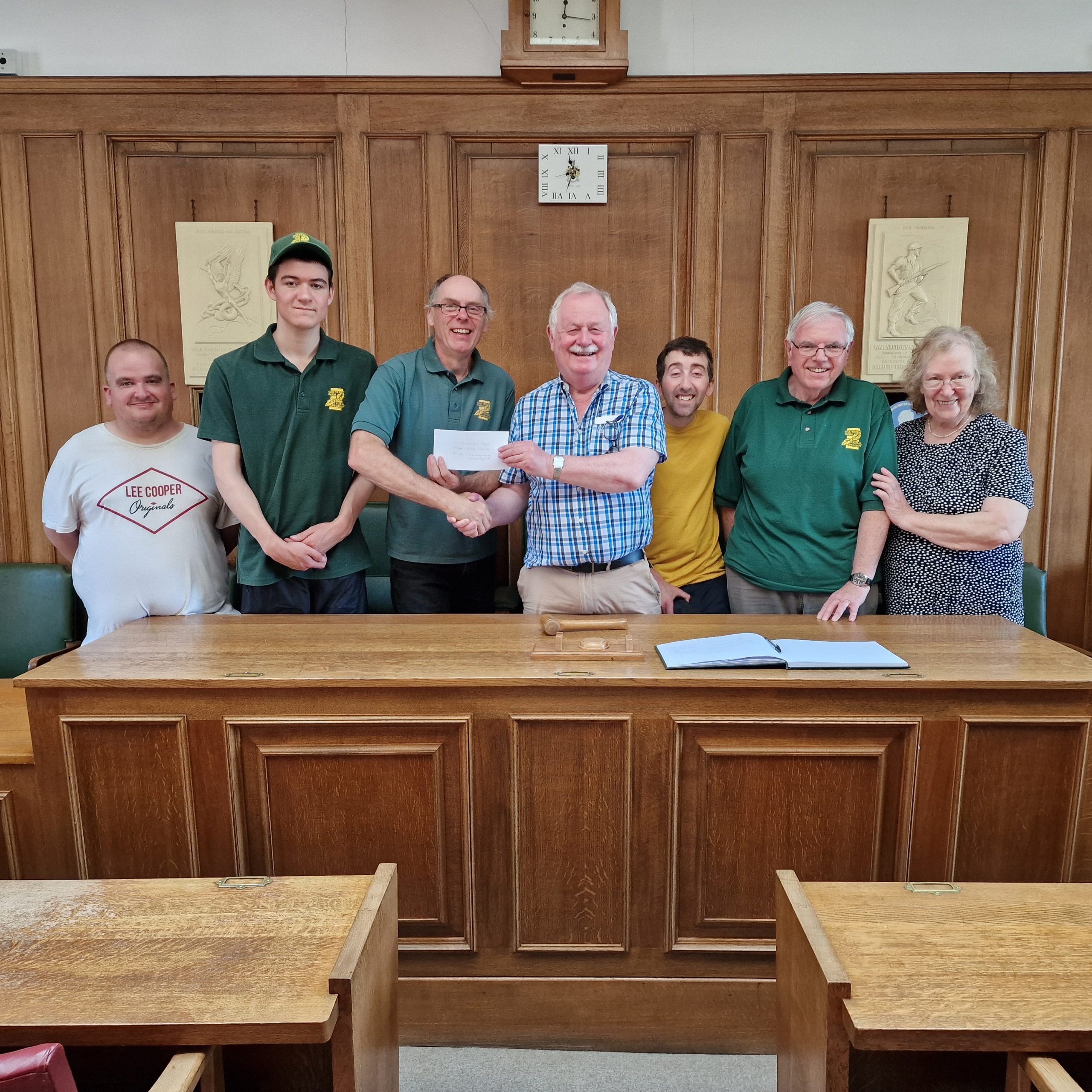 Past Mayor 2023-24, Councillor Jim Davies, awarding Mayor's Charity representatives from Oak Tree Farm Rural Project, their share of the funds raised.