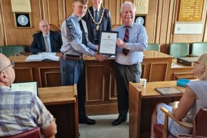 Town Mayor 2023-24 presenting Air Cadet with his Certificate of Appreciation