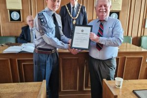 Town Mayor 2023-24 presenting Air Cadet with his Certificate of Appreciation